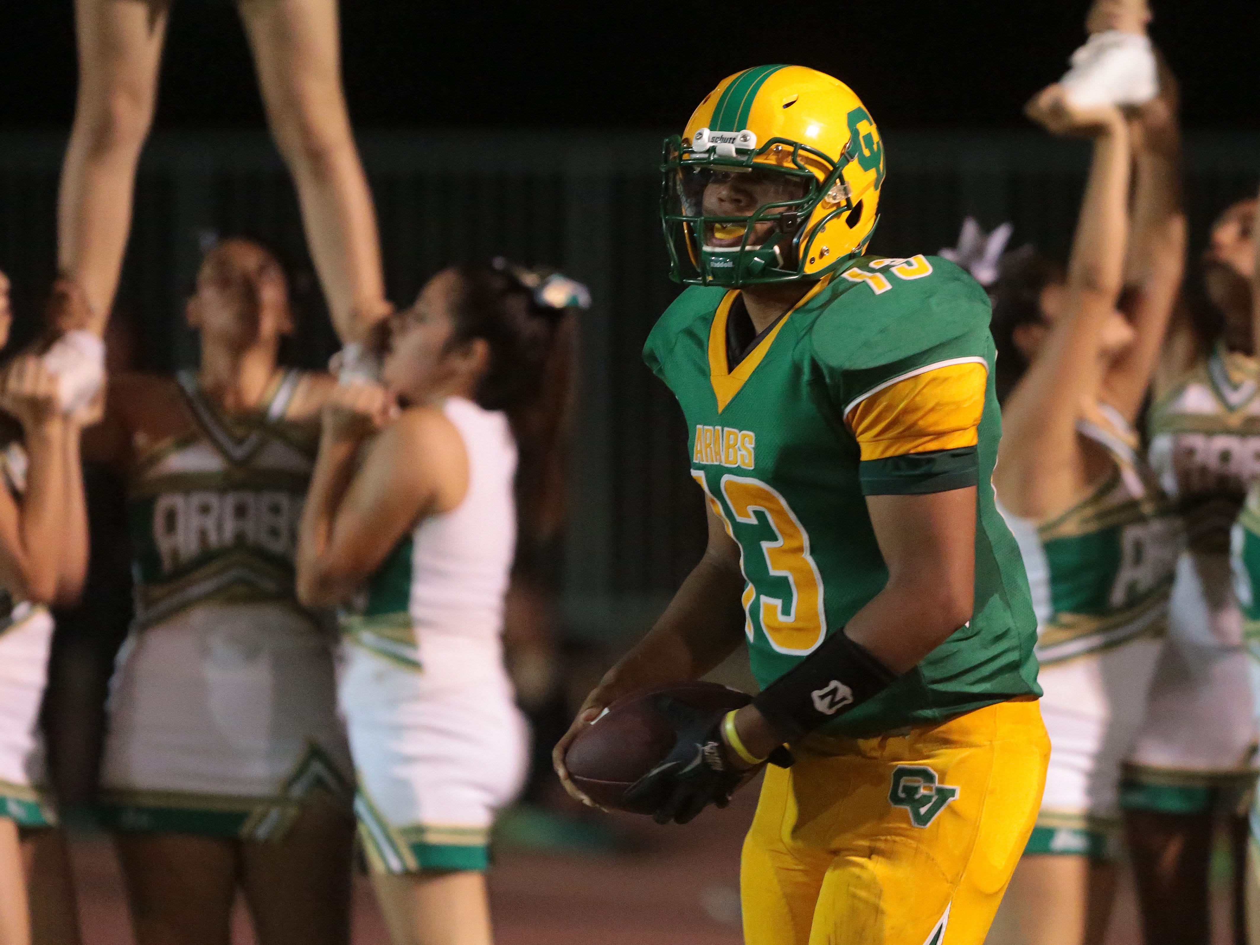  Coachella Valley quarterback Darius Hulsey surveys the field against Cathedral City on Friday. Hulsey became the first Arabs’ player ever to throw for 400 yards in a game. 