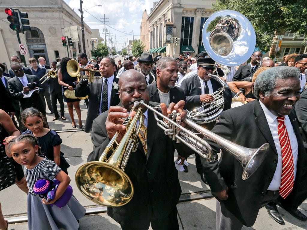 A Jazz funeral procession for Dolores Ferdinand Marsalis makes its way along South Carrollton Avenue in New Orleans. Dolores Ferdinand Marsalis, matriarch of one of New Orleans' great musical families, died July 18, 2017, of pancreatic cancer.