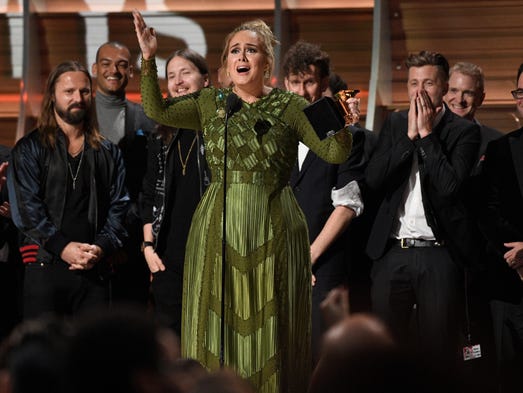Adele accepts the award for Album of the Year during