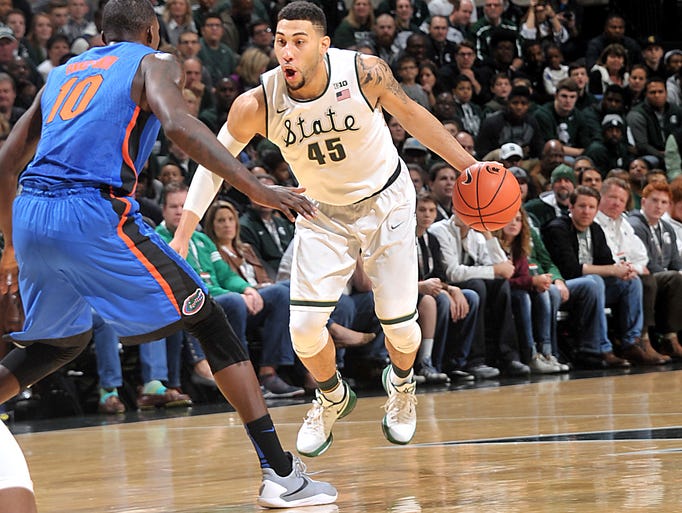 MSU pulls away late to defeat Florida; UDM wins again for Reggie 635855436206634642-121215-dy-FLAvMSUmbkb0010