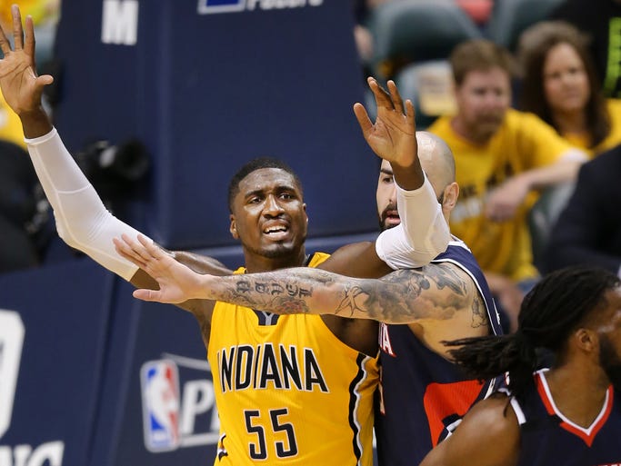 Pacers center Roy Hibbert is pressured by Atlanta Hawks center Pero Antic towards the end of the second half of Saturday's Eastern Conference playoff game against the Atlanta Hawks at Bankers Life Fieldhouse on April 19, 2014. The Pacers lost 93-108.