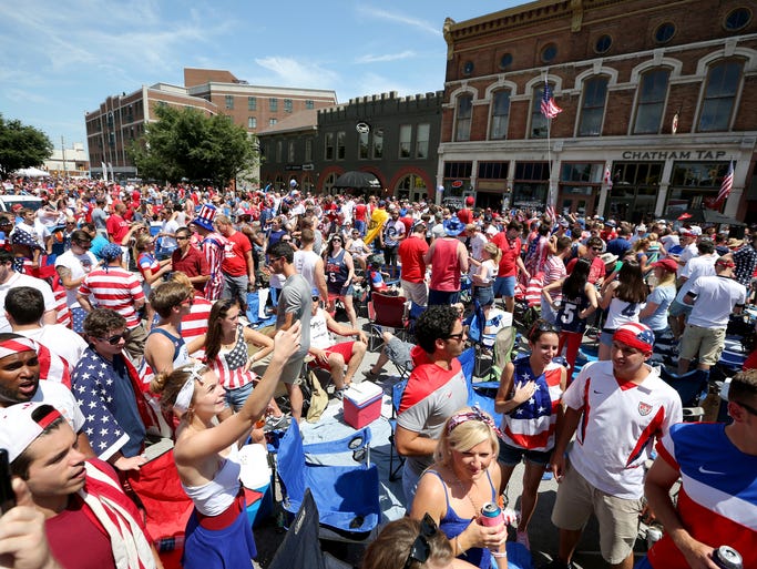 The World Cup Block Party on Mass Ave. fills the streets with soccer fans awaiting for the start of the The World Cup Game where the US will play Belgium in Brazil Tuesday, July 1, 2014.