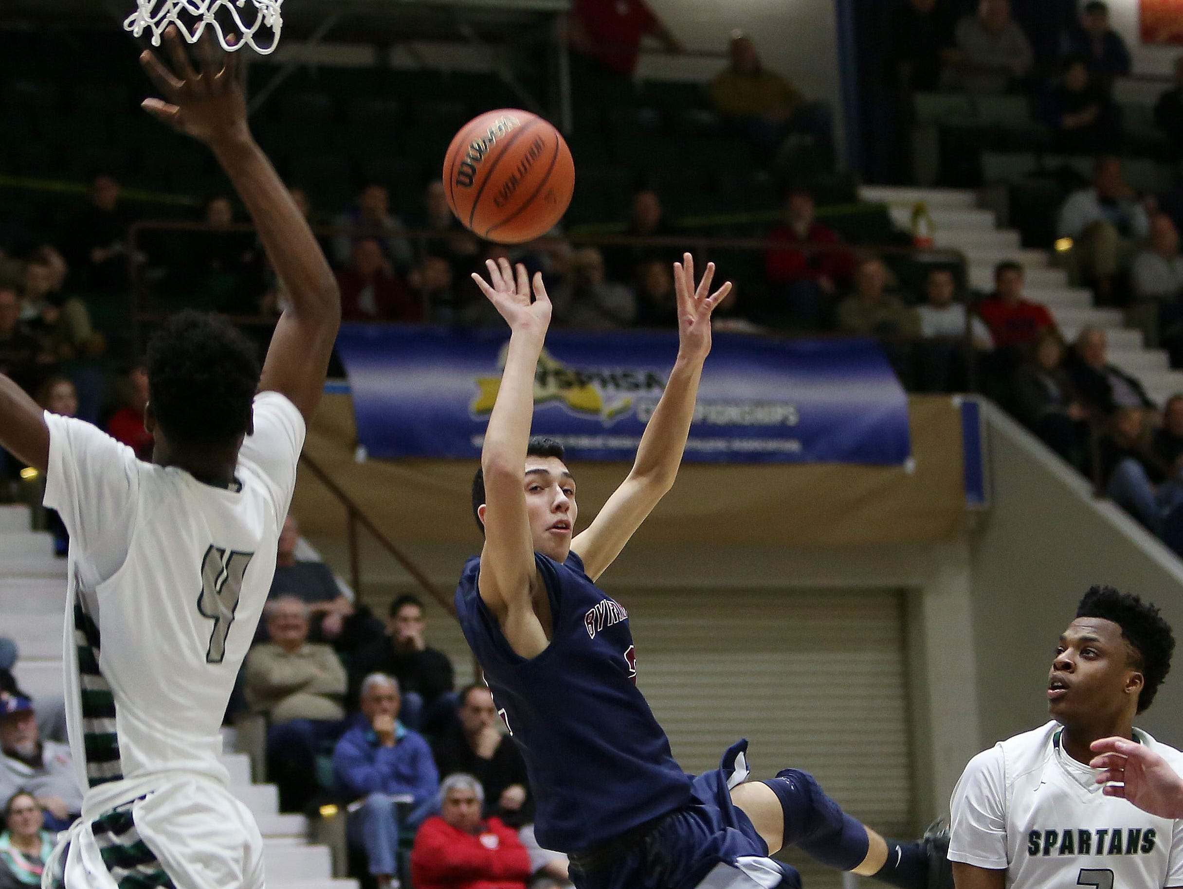 Byram Hills' Skylar Sinon (2) has his path to the basket blocked by a host of Elmont defenders during the New York State boys basketball Class A semifinal game at the Glens Falls Civic Center March 12, 2016. Element won the game 50-48.