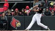 Louisville's Corey Ray smacks a single against Indiana.
