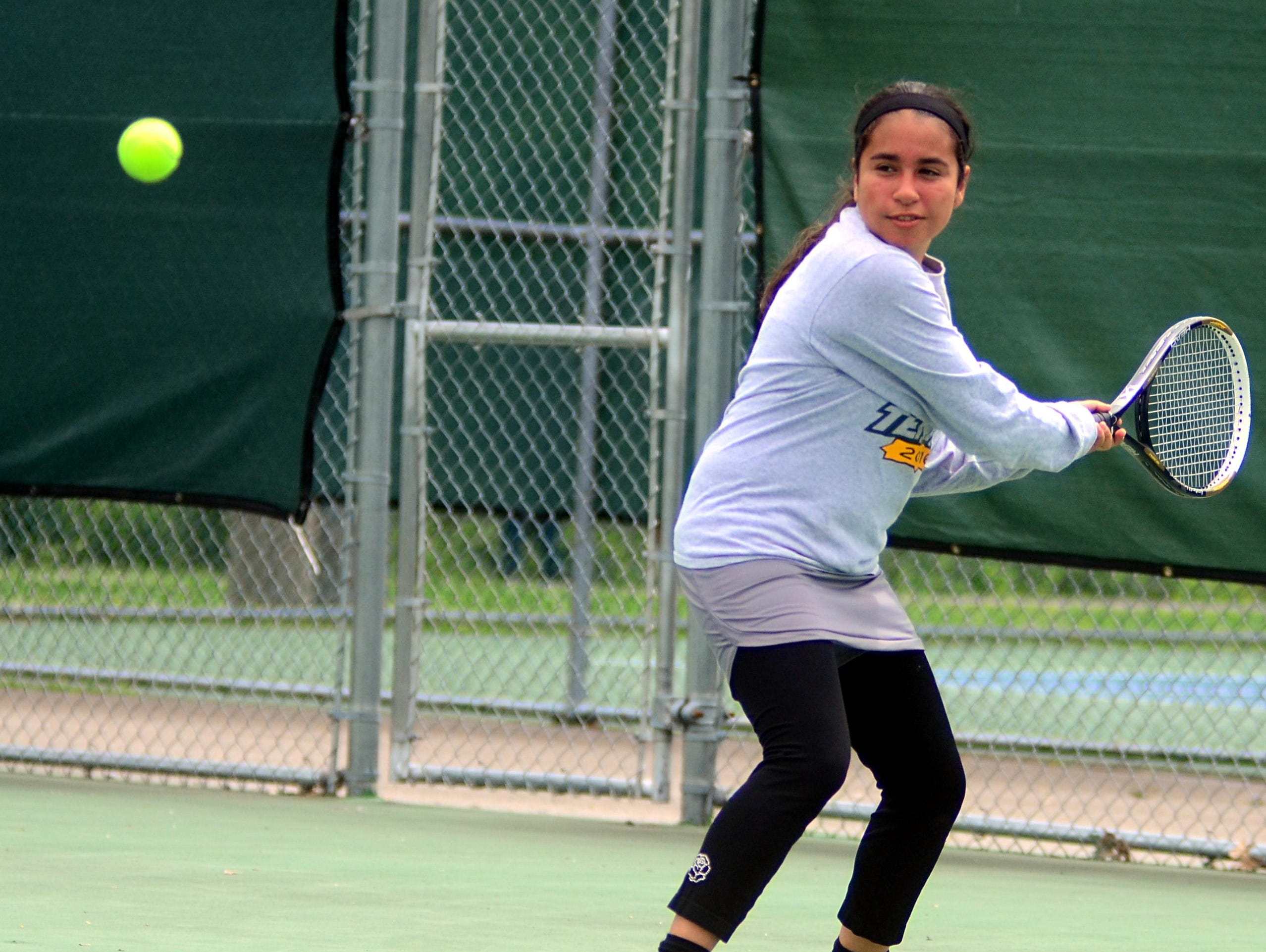 Gallatin High senior Erika Urena prepares to hit a backhand during Tuesday’s District 9-AAA Individual Tennis Tournament. Urena suffered a straight-set loss in the first round of the singles tournament.