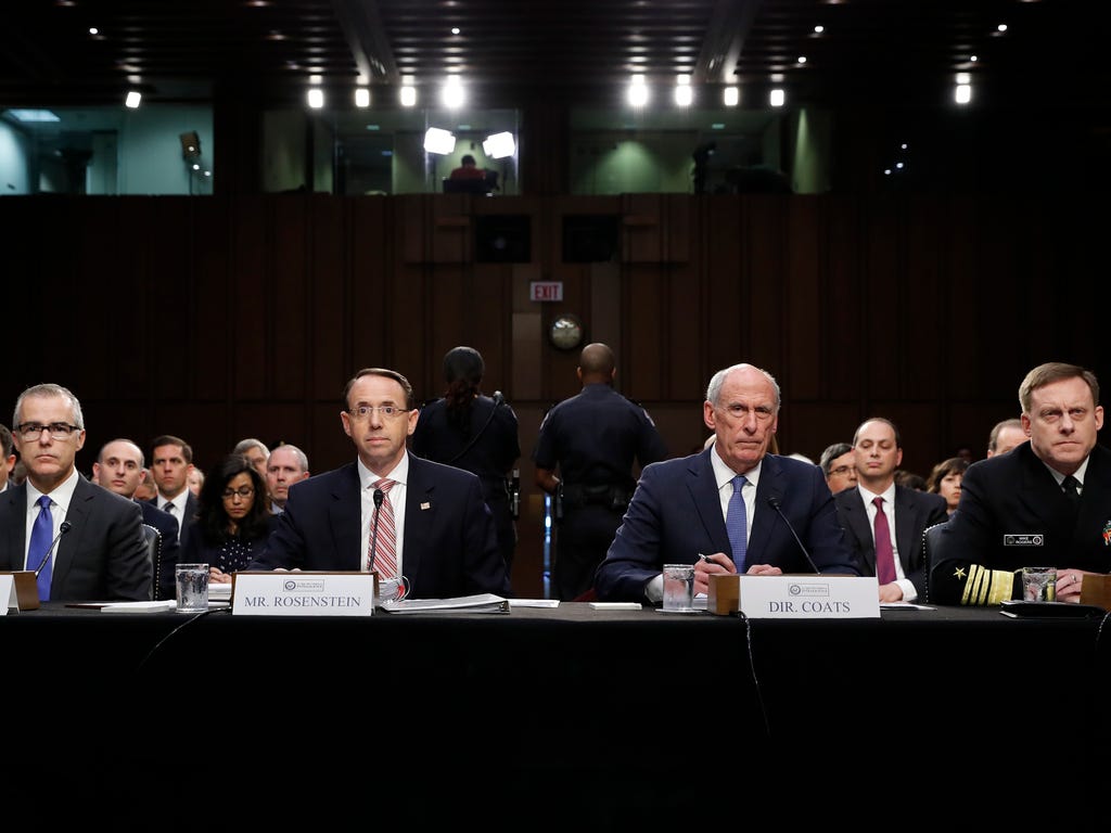 From left, Acting FBI Director Andrew McCabe, Deputy Attorney General Rod Rosenstein, National Intelligence Director Dan Coats, and National Security Agency Director Adm. Michael Rogers are seated during a Senate Intelligence Committee hearing about 