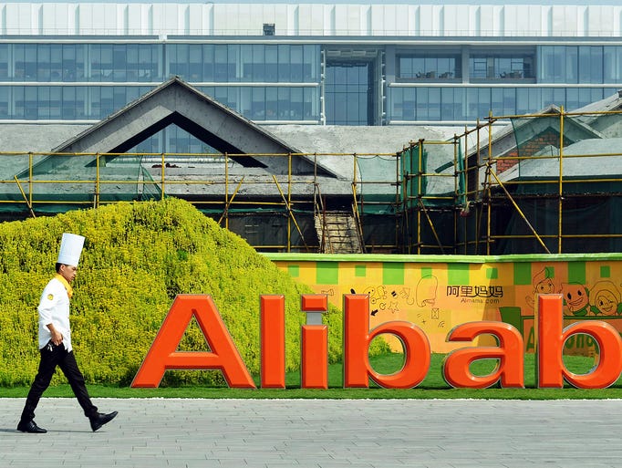 A chef walks into the headquarters of the Alibaba Group on Aug. 27 in Hangzhou, China.