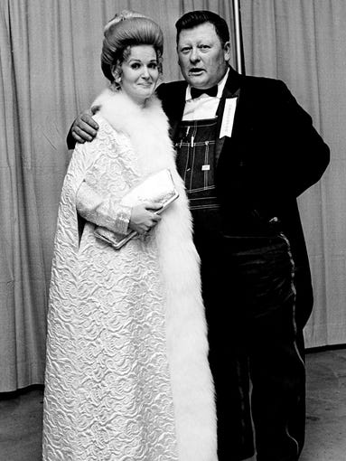 "Black tie," they said in the invitation to the Grammy Awards banquet, and black tie it is for Junior Samples, star of "Hee Haw" and a presenter. He even wears a full dress jacket with tails with his overalls at the event March 11, 1970. Recording star Lynn Anderson, left, doesn't seem to mind.