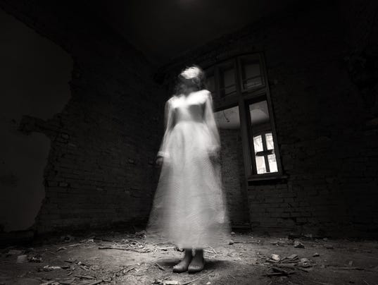 Ghost girl in white dress in ruined house