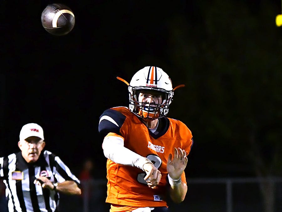 Dickson County quarterback Jacob Murphree fires a pass against Creek Wood. Creek Wood vs Dickson County at Dickson County Stadium. Aug. 19, 2016.