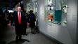Trump walks past an exhibit for Dr. Ben Carson, his
