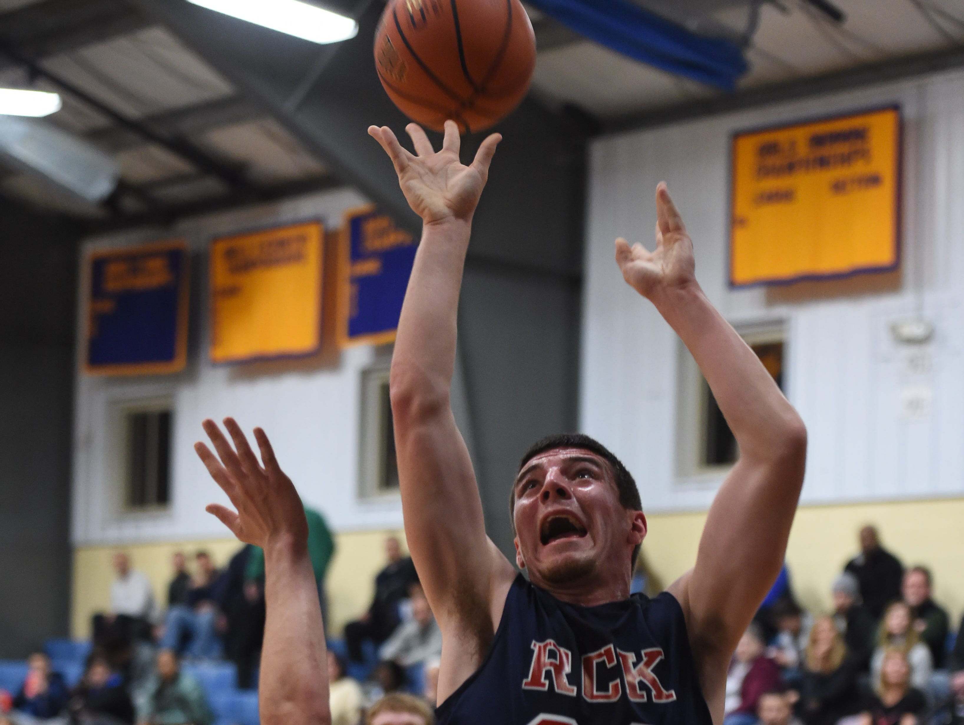Ketcham's Tim Reilly shoots the ball over Arlington's Evan Greco during the Duane Davis Memorial Holiday Tournament in Poughkeepsie on Wednesday.