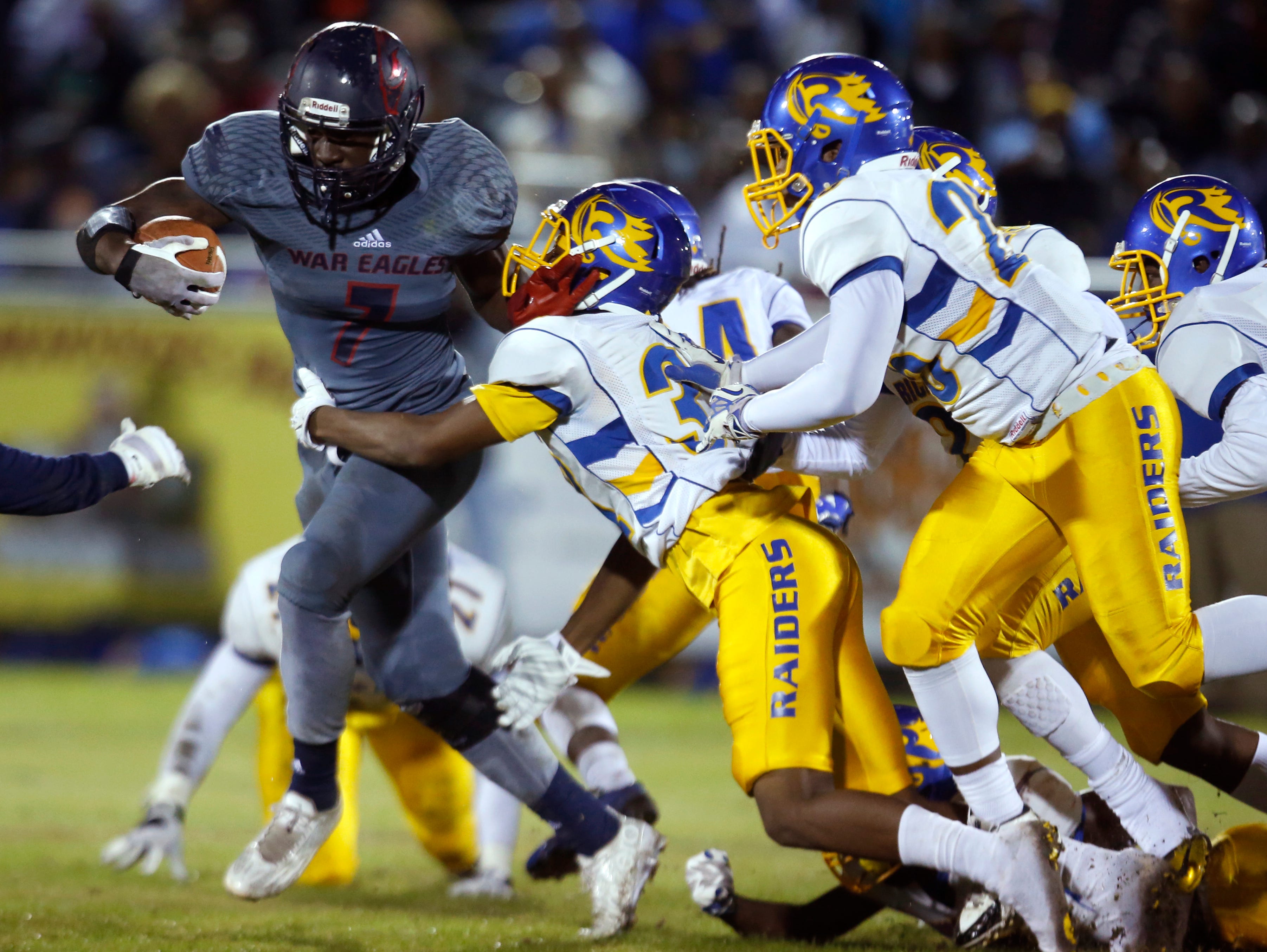 Wakulla's Keith Gavin breaks away from a multitude of Rickards defenders during a punt return for a touchdown in their playoff game on Friday.
