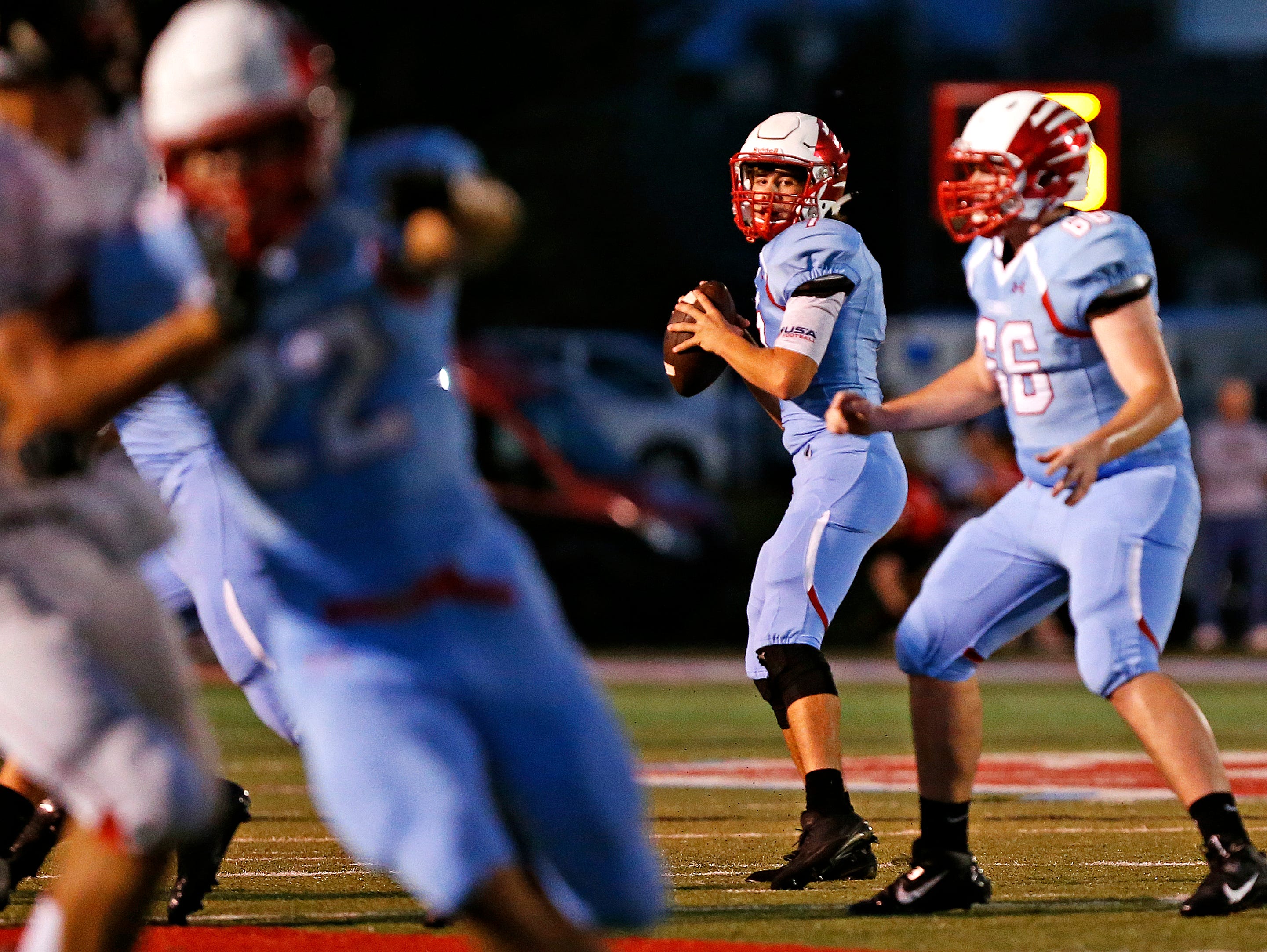Glendale High School quarterback Alex Houston (7) gets ready to throw the ball during second quarter action of the Falcons game against West Plains High School at Lowe Stadium in Springfield, Mo. on Sept. 2, 2016.