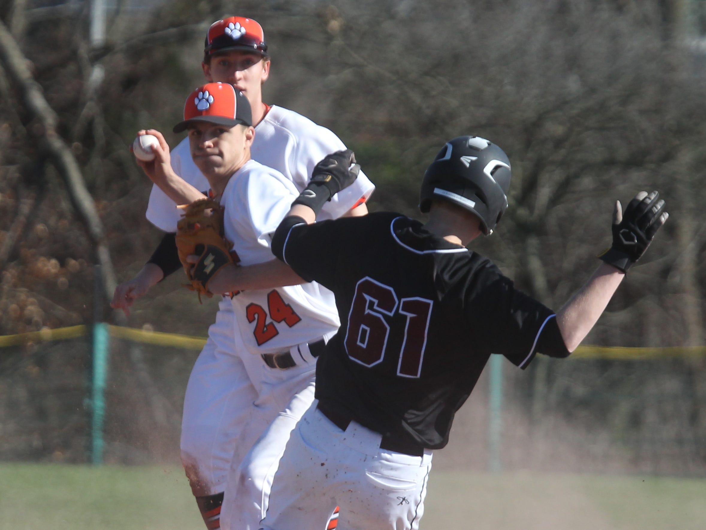 White Plains' Jack Dimarco forces out Scarsdale's Joseph Weintraub, who broke up the double play during a game at White Plains April 12, 2016. White Plains won 7-0.