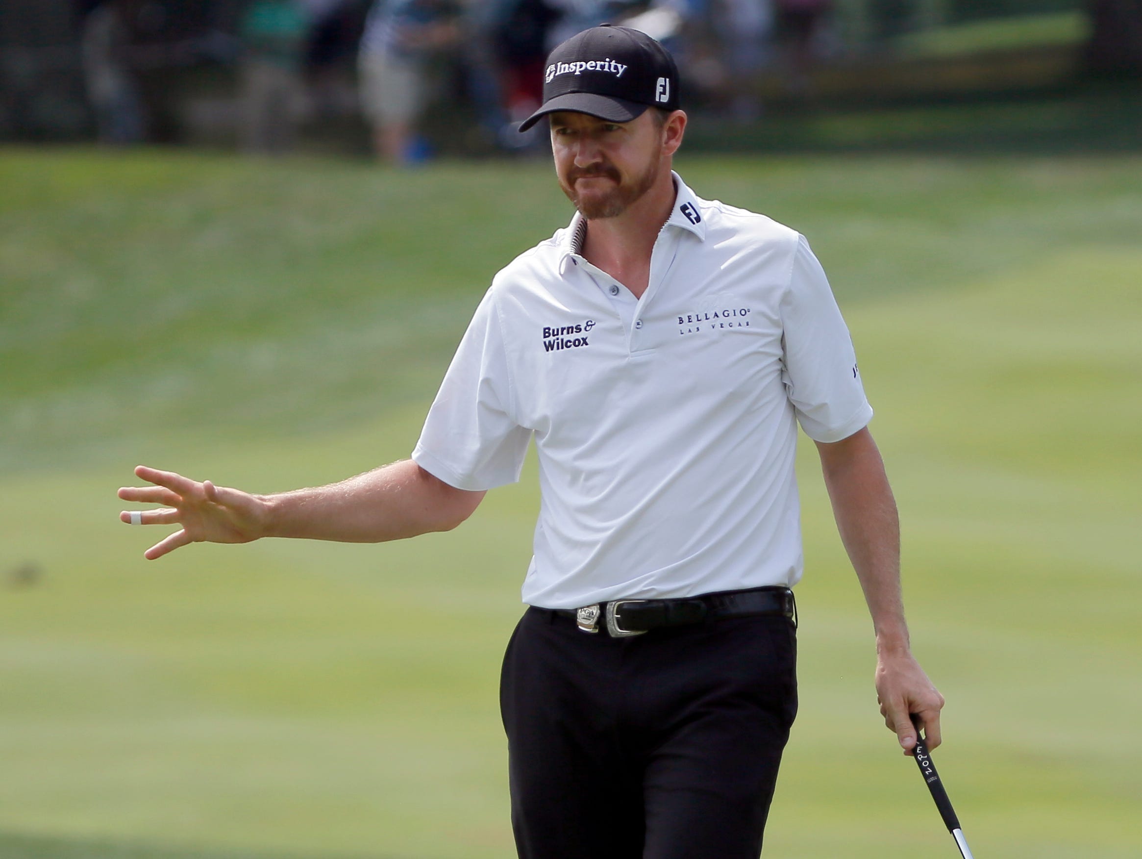 Jimmy Walker reacts to his putt on the third hole during the first round of the PGA Championship golf tournament at Baltusrol Golf Club in Springfield, N.J., Thursday, July 28, 2016. (AP Photo/Tony Gutierrez)