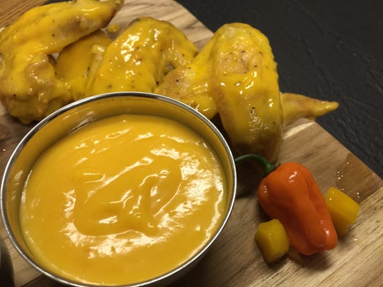 Chicken wings in a habanero mango sauce.