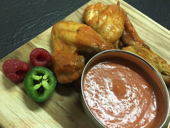 Chicken wings in a raspberry jalapeno sauce.