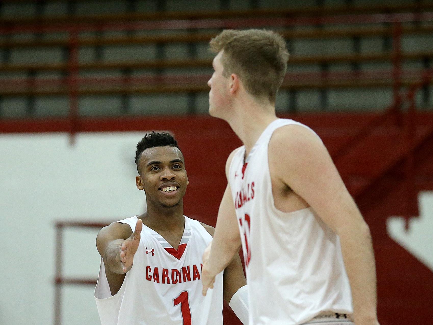 FILE – Paul Scruggs (left) and Joey Brunk (right) led the Cardinals to Southport’s first sectional title in 16 years Saturday.