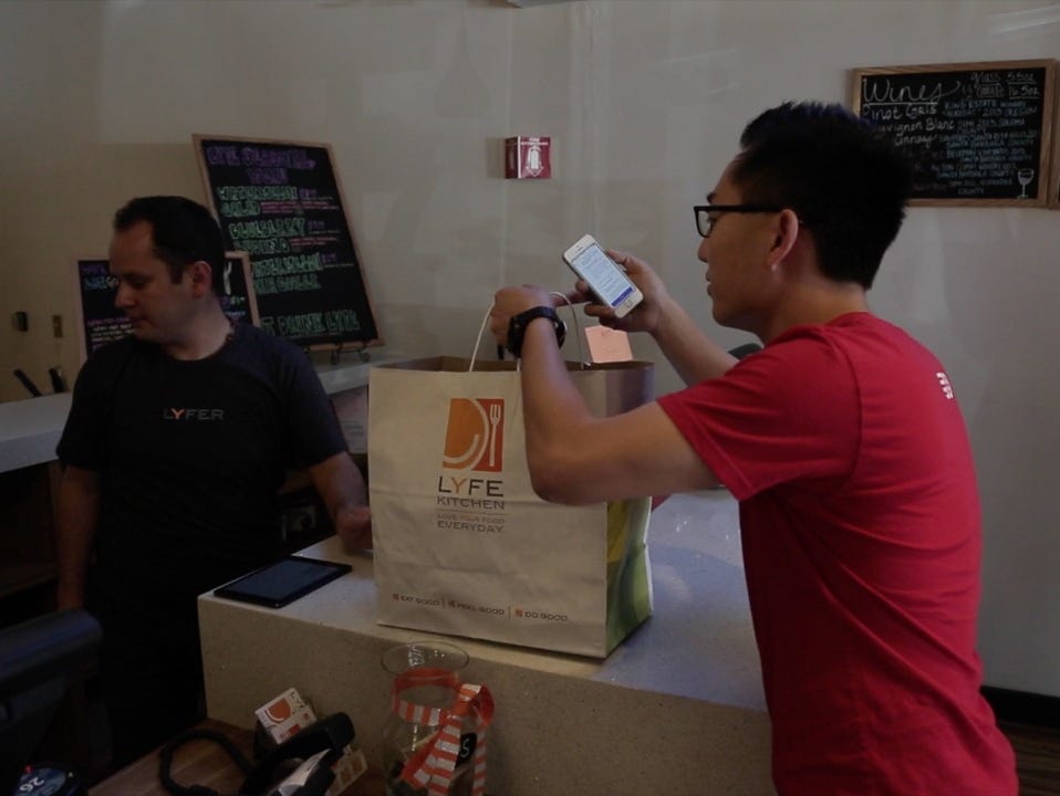 Tony Xu picks up an order for DoorDash from Lyfe Kitchen