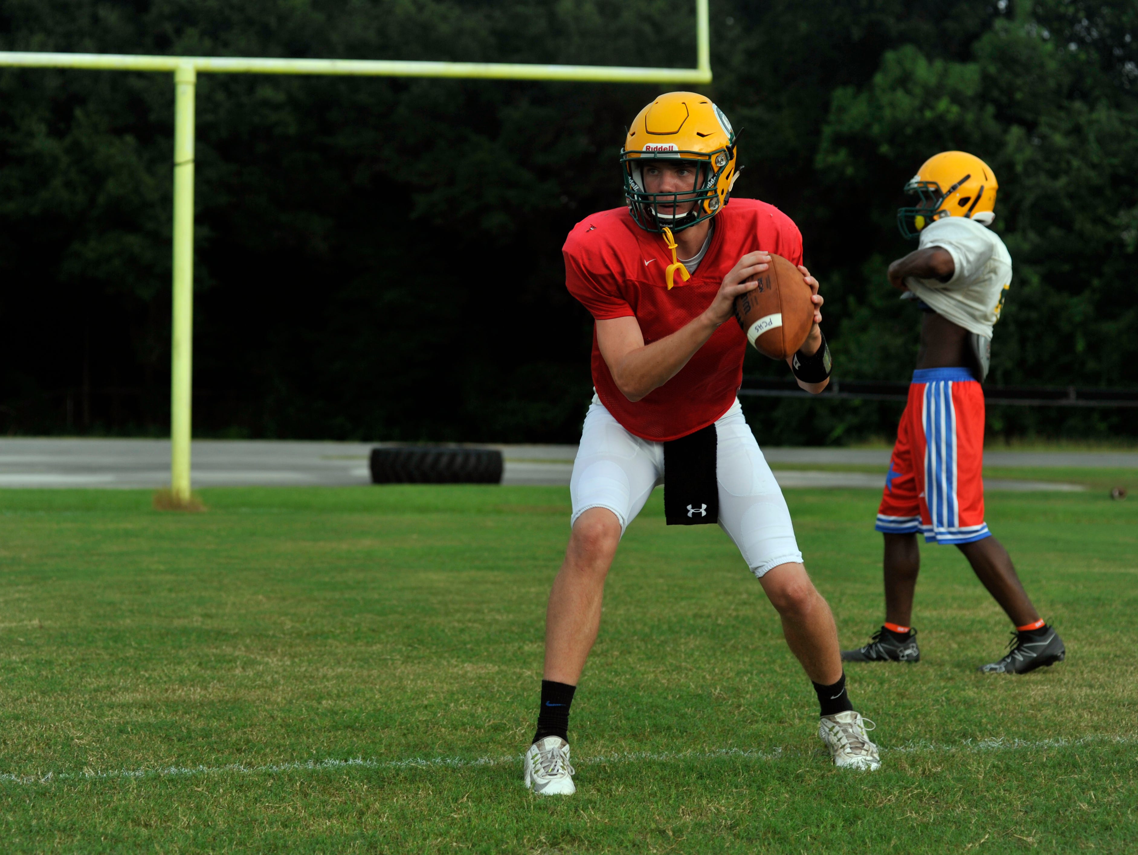 Pensacola Catholic quarterback Garrett Foley takes reps during practice.