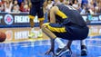 West Virginia forward Nathan Adrian (11) reacts after