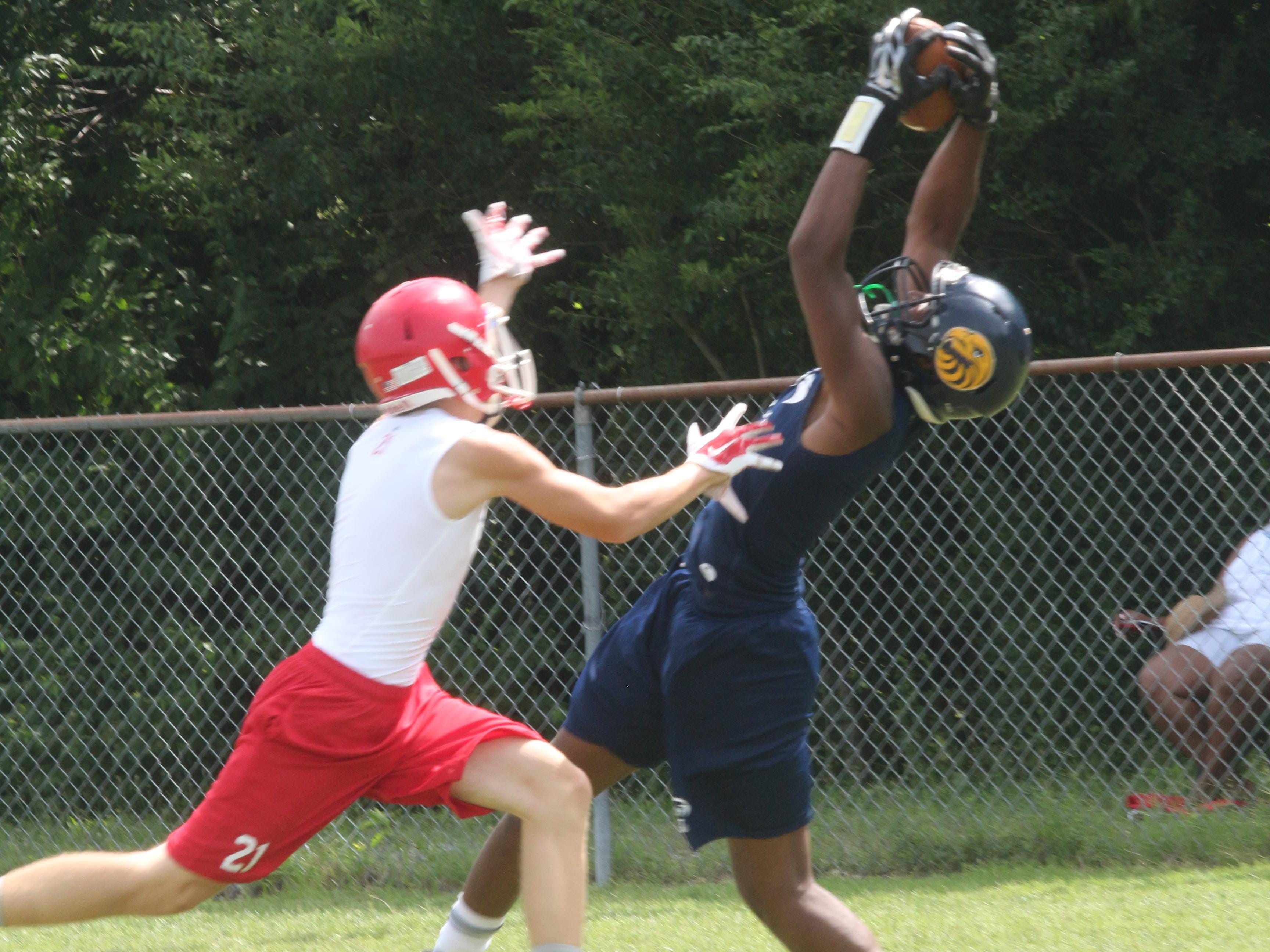 Northeast wideout William Wilcox snags a pass from quarterback Benji Burchwell against Montgomery Central during the tournament portion of the National Select 7-on-7 competition Thursday at Clarksville High School.