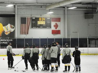 Players listen to instruction during drills at Southern Elite Sports Preparatory School, which offers students ice hockey training and education at A-Gage Sportsplex in Franklin.