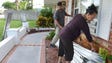 Allen Abreu helps  his mother, Maria, put up hurricane