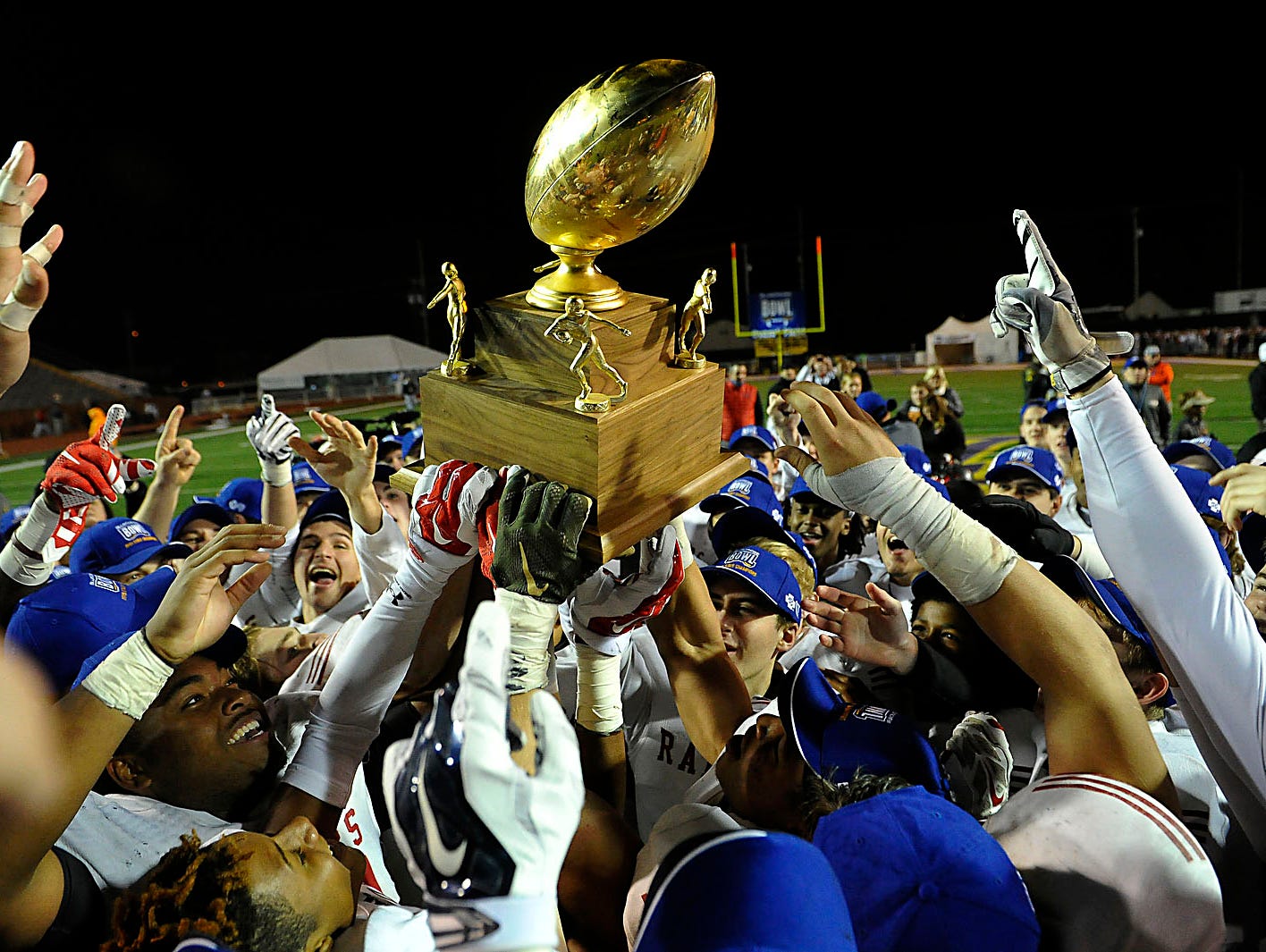 Ravenwood celebrates the Class 6A BlueCross Bowl on Dec. 5, 2015, in Cookeville. The Raptors won 26-17 over Maryville.