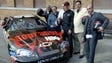 Clint Bowyer drove a Chevrolet sponsored by HBO's hit series "The Sopranos" for the 2006 race at Las Vegas Motor Speedway. Bowyer, third from right, poses with cast members (from left to right) Frank Vincent, Joe Gannascoli, Vincent Curatola, Steve Schirripa, and John Ventimiglia.