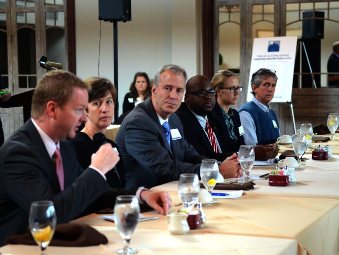 City council candidates from left, Rich Lee, Julie