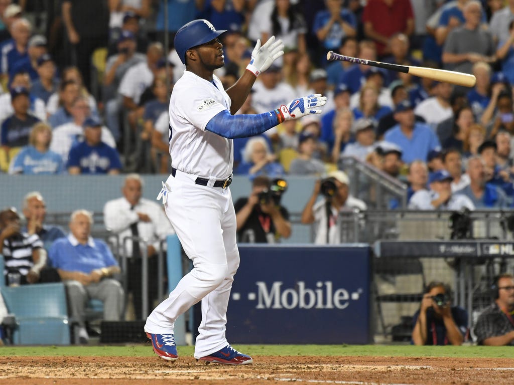 The Los Angeles Dodgers' Yasiel Puig hits a single during the fourth inning in Game 2 of the NLDS against the Arizona Diamondbacks at Dodger Stadium. The Dodgers won the game 8-5 to take a 2-0 series lead.