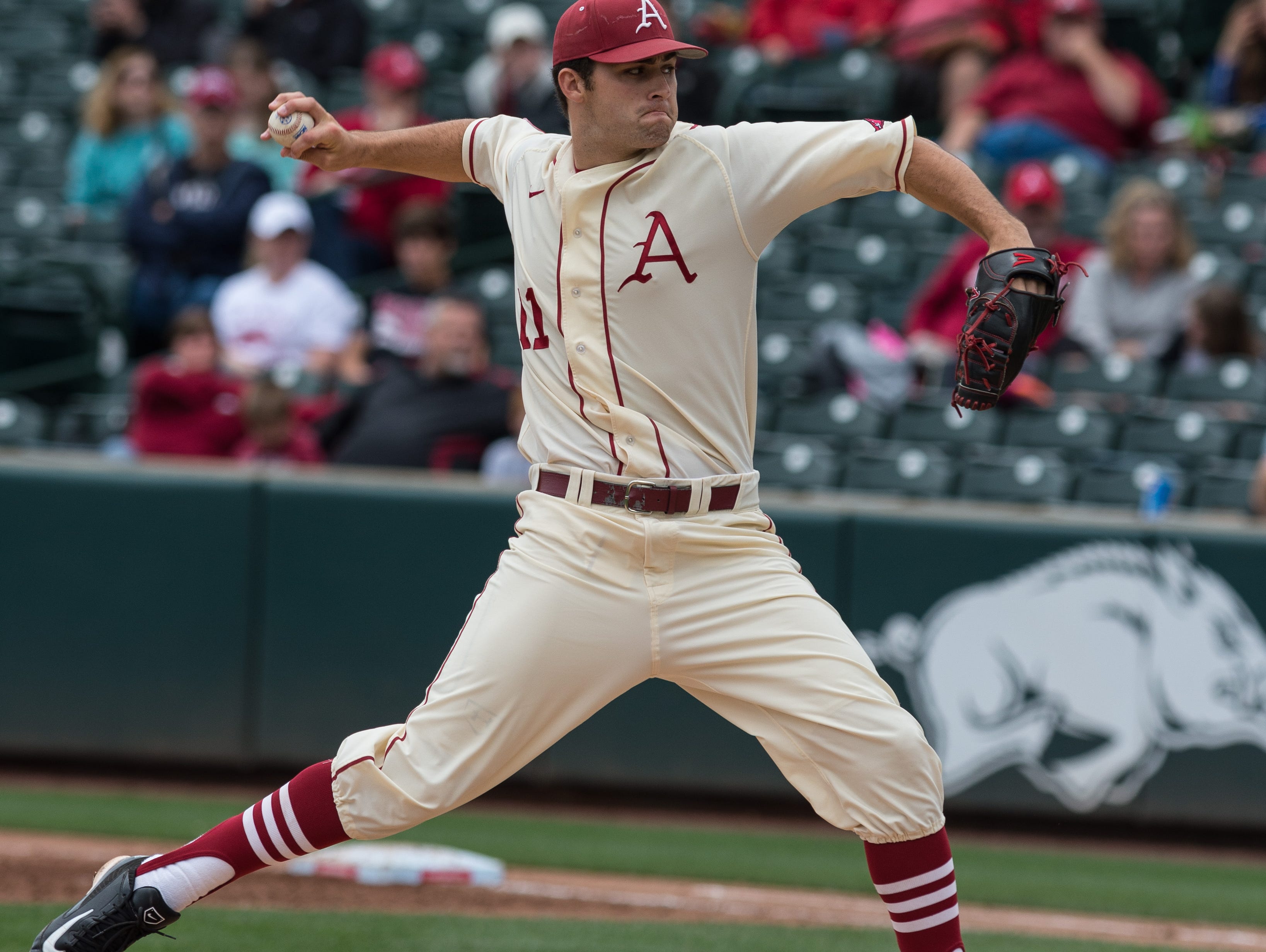 Arkansas pitcher Keaton McKinney delivers a pitch against Tennessee on Sunday at Baum Stadium in Fayetteville.