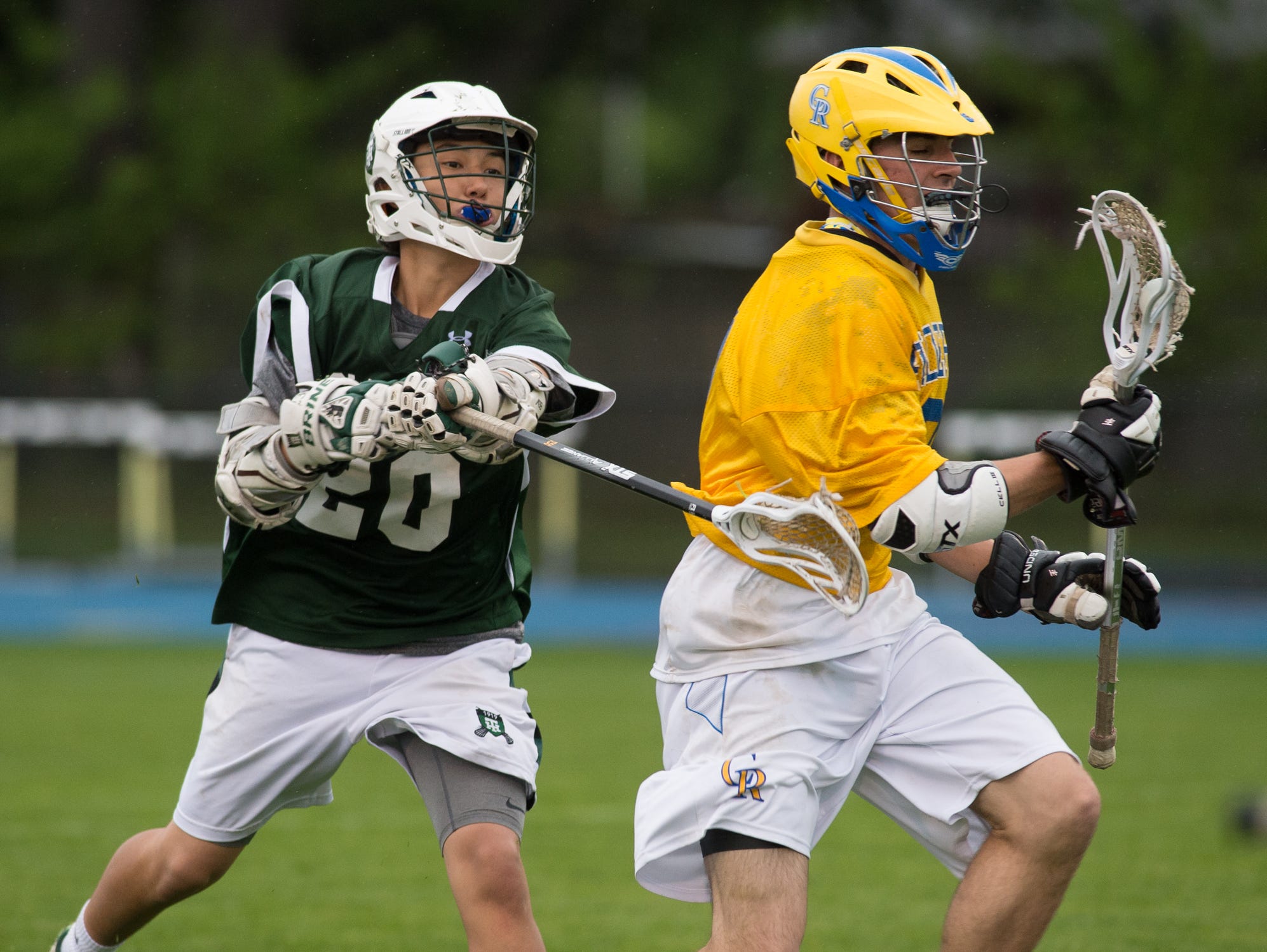 Tower Hill's William Togo (20) reaches for the ball in their win over Caesar Rodney.