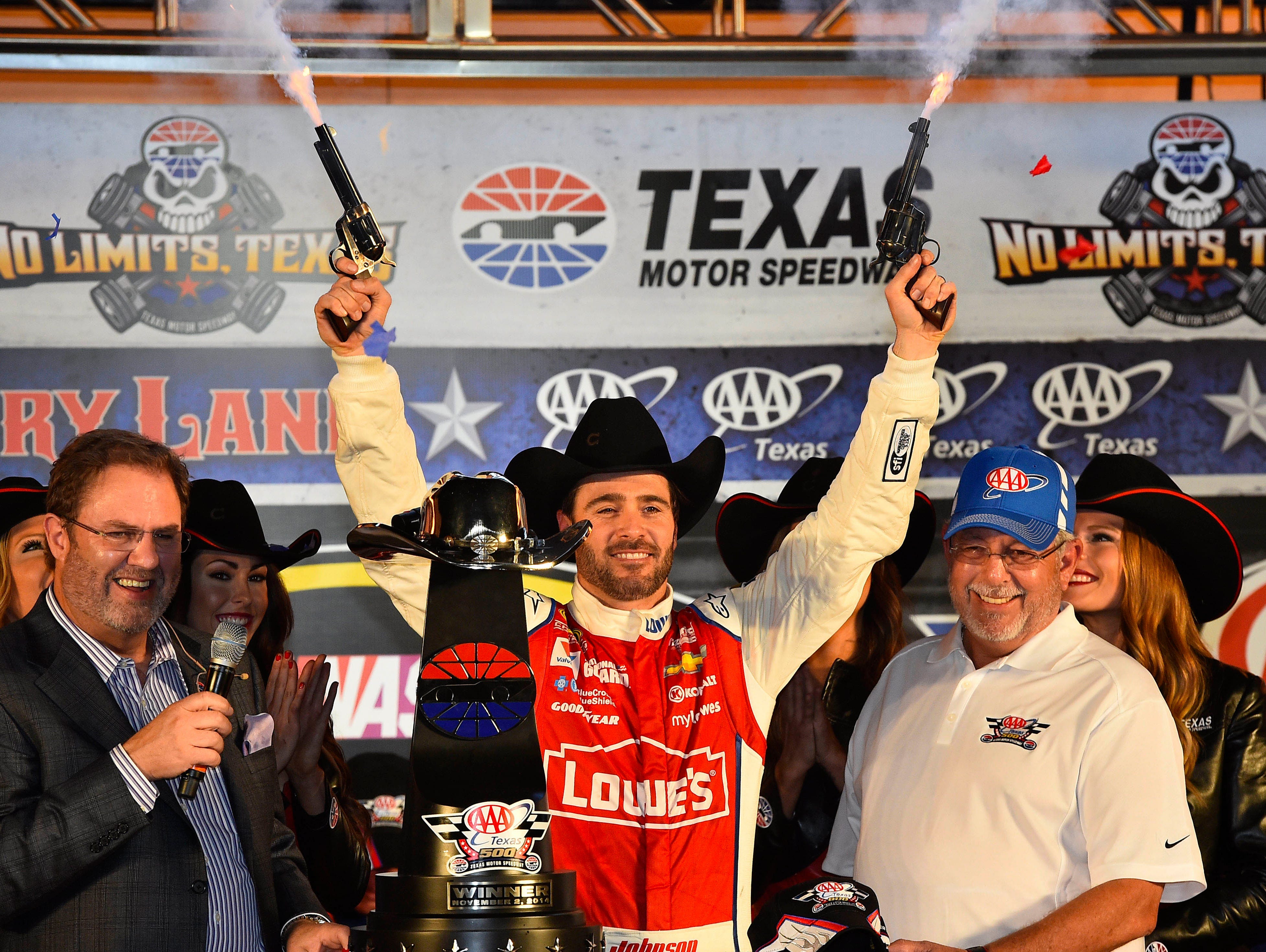 Jimmie Johnson celebrates winning the AAA Texas 500 Sunday at Texas Motor Speedway.