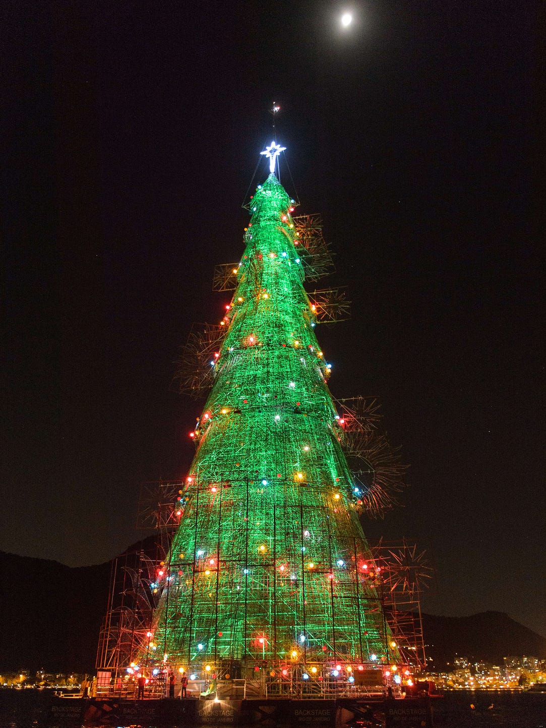 A 85-meter-high floating Christmas tree illuminates
