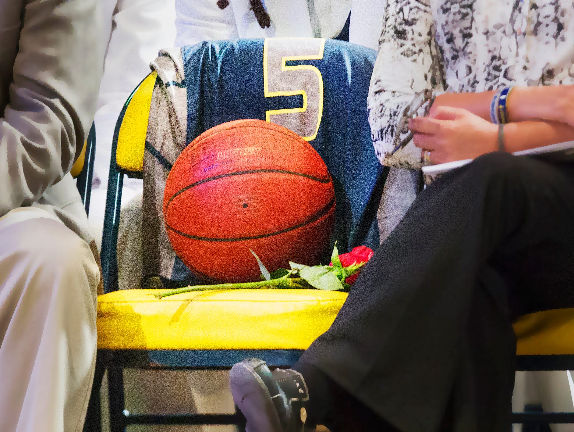 Stef'An Strawder's jersey drapes a seat of remembrance Saturday during his funeral at New Life Assembly of God in Lehigh Acres. Strawder was killed recently in the Club Blu nightclub shooting in Fort Myers.