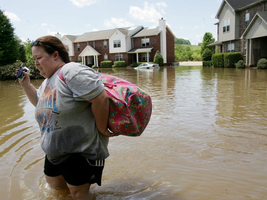 Jenny Tygard walks through deep water with some of