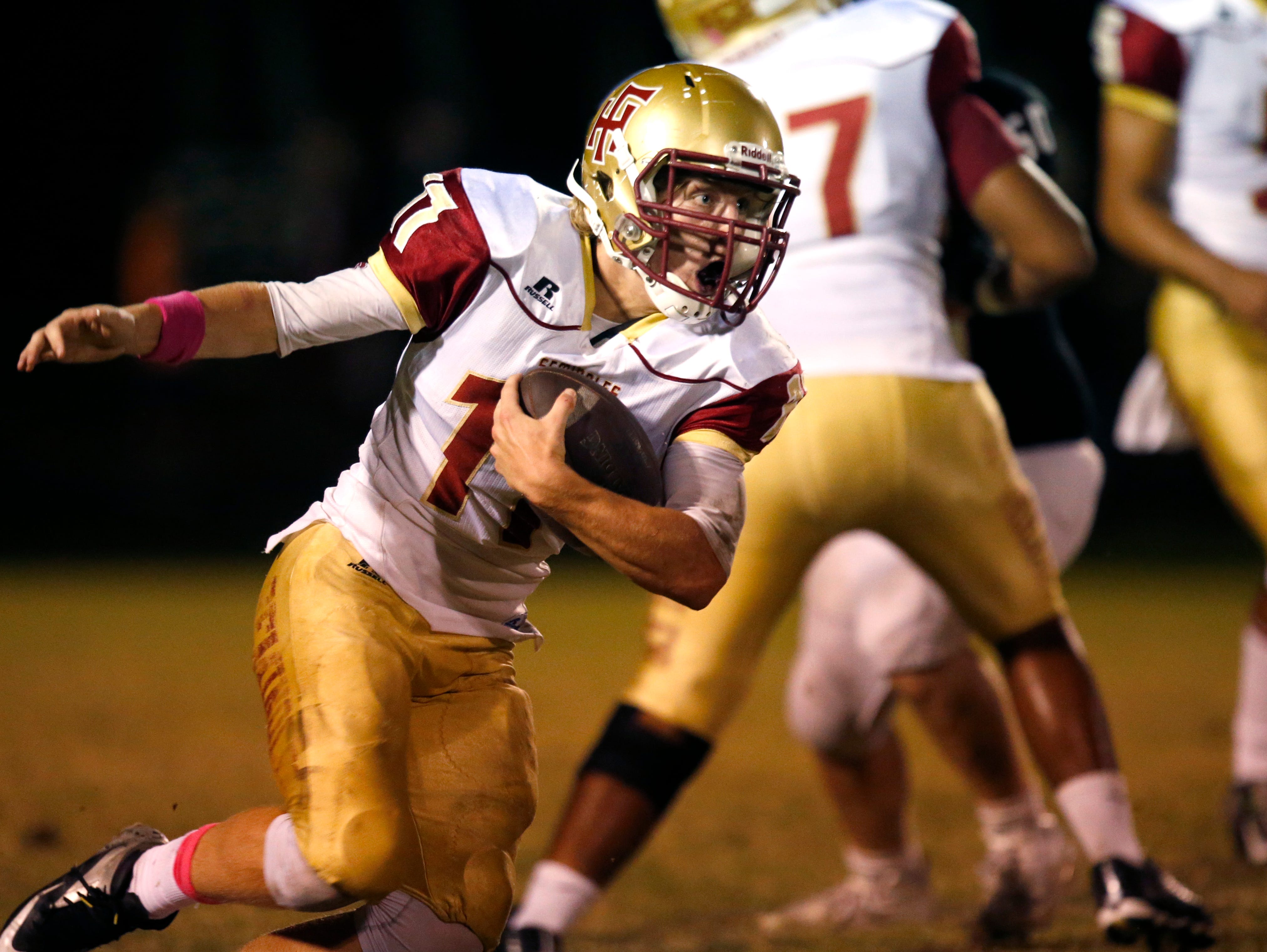 Florida High's Mike Greaves runs the ball against NFC on Friday.