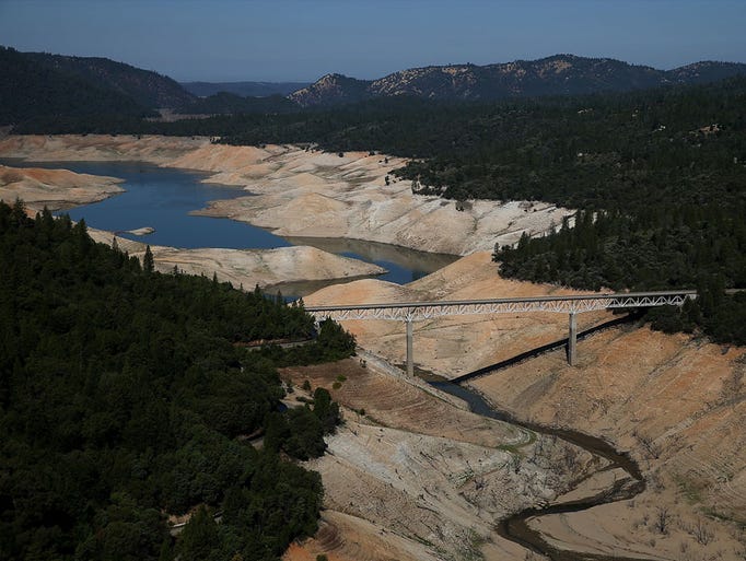 The Enterprise Bridge passes over a section of Lake Oroville that is nearly dry on August 19, 2014 in Oroville, California.