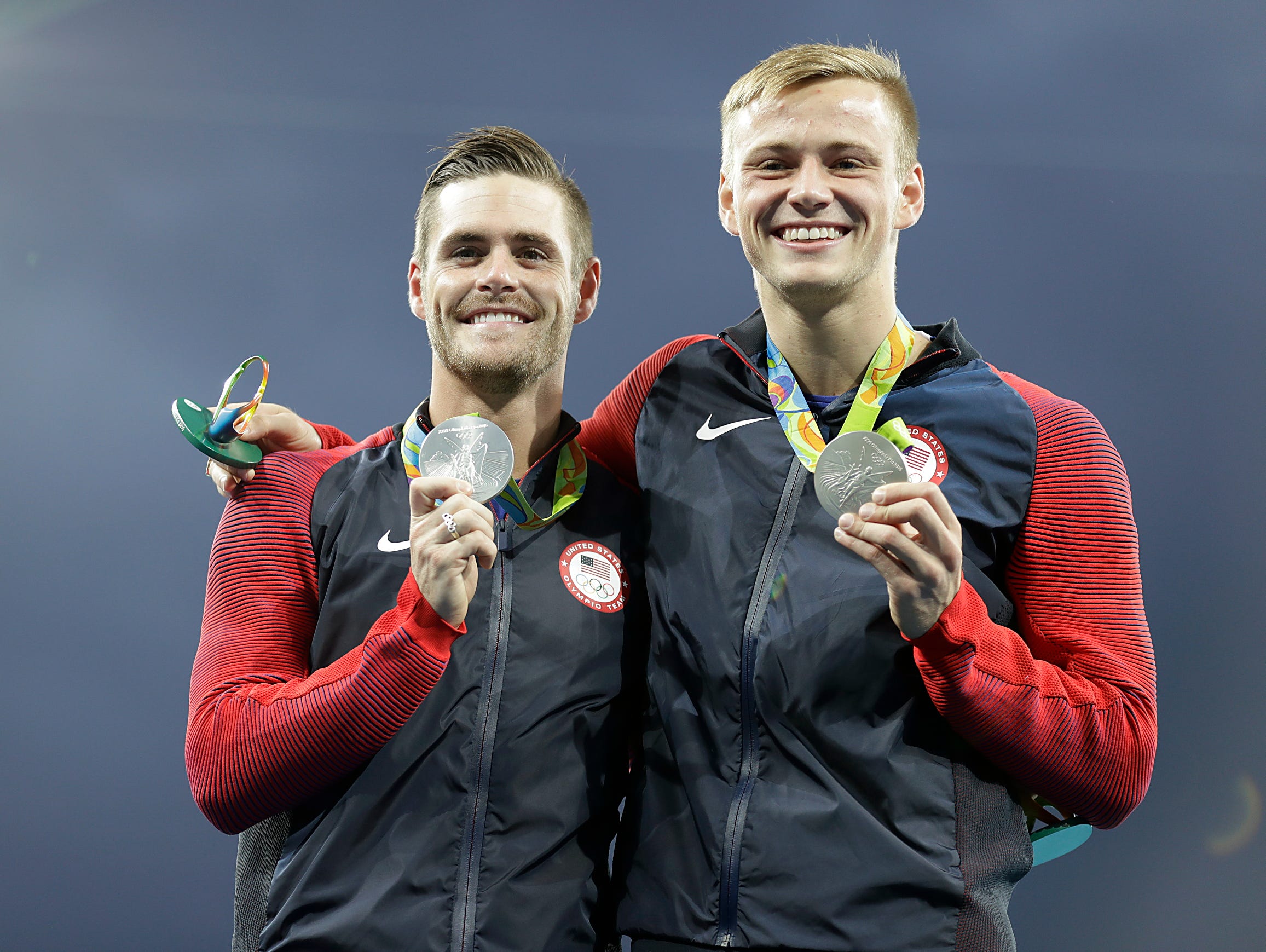 United States' silver medalists Steele Johnson, right, and David Boudia, left, pose with their medals after the men's synchronized 10-meter platform diving final in the Maria Lenk Aquatic Center at the 2016 Summer Olympics in Rio de Janeiro.