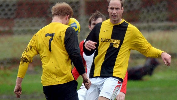 Prince Harry and Prince William play soccer at their