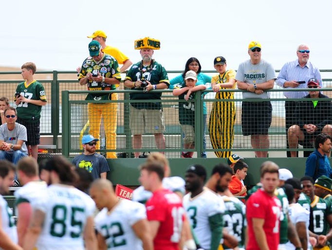Fans watch Green Bay Packers minicamp practice at Ray Nitschke Field, Thursday, June 19, 2014.