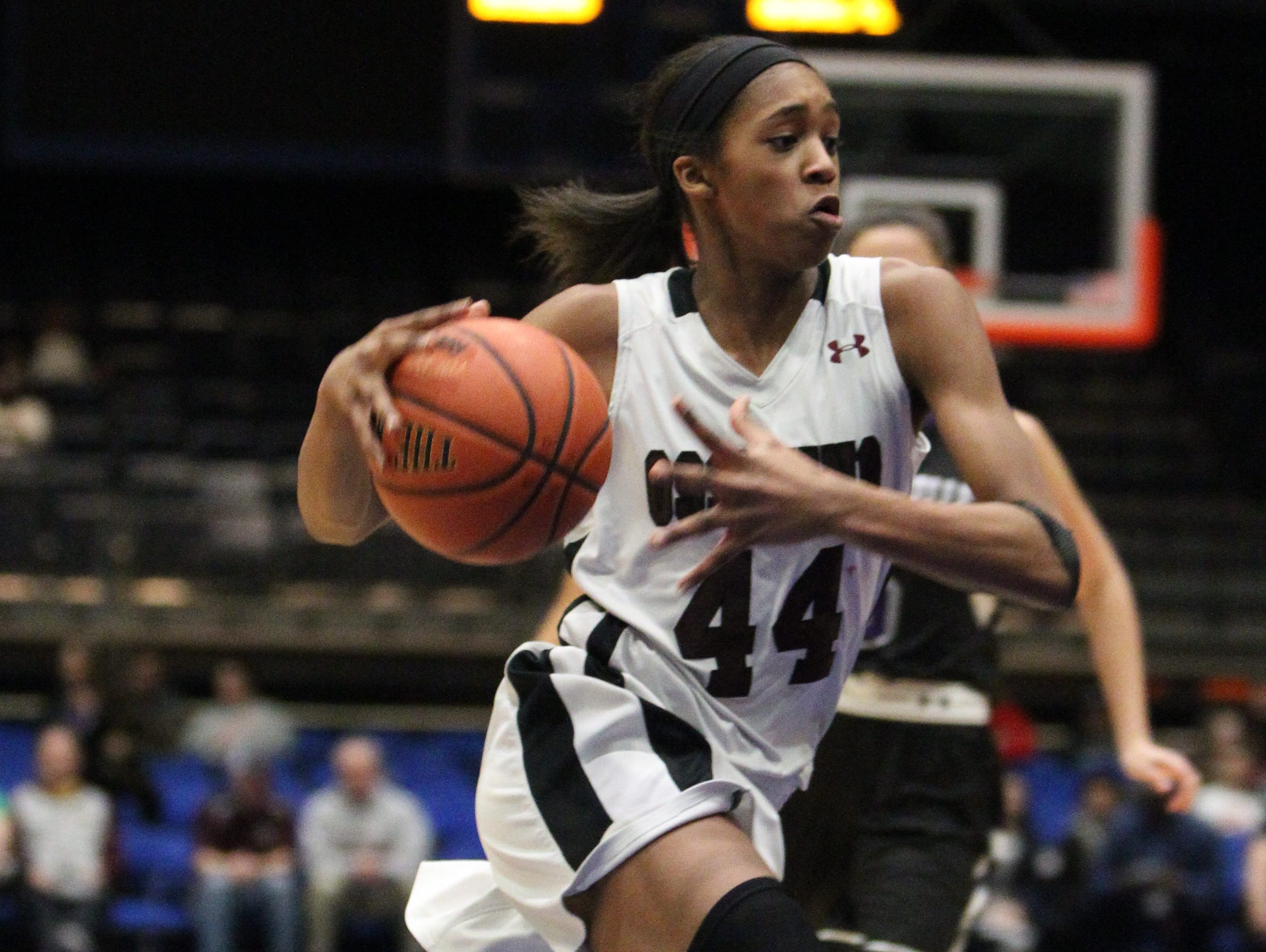 Ossining's Aubrey Griffin drives to the net during a Section 1 Class AA girls basketball semifinal with New Rochelle at the Westchester County Center Feb. 25, 2016.