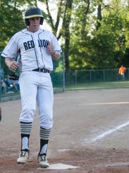 Red Lion's Tyler Taylor touches home plate during a