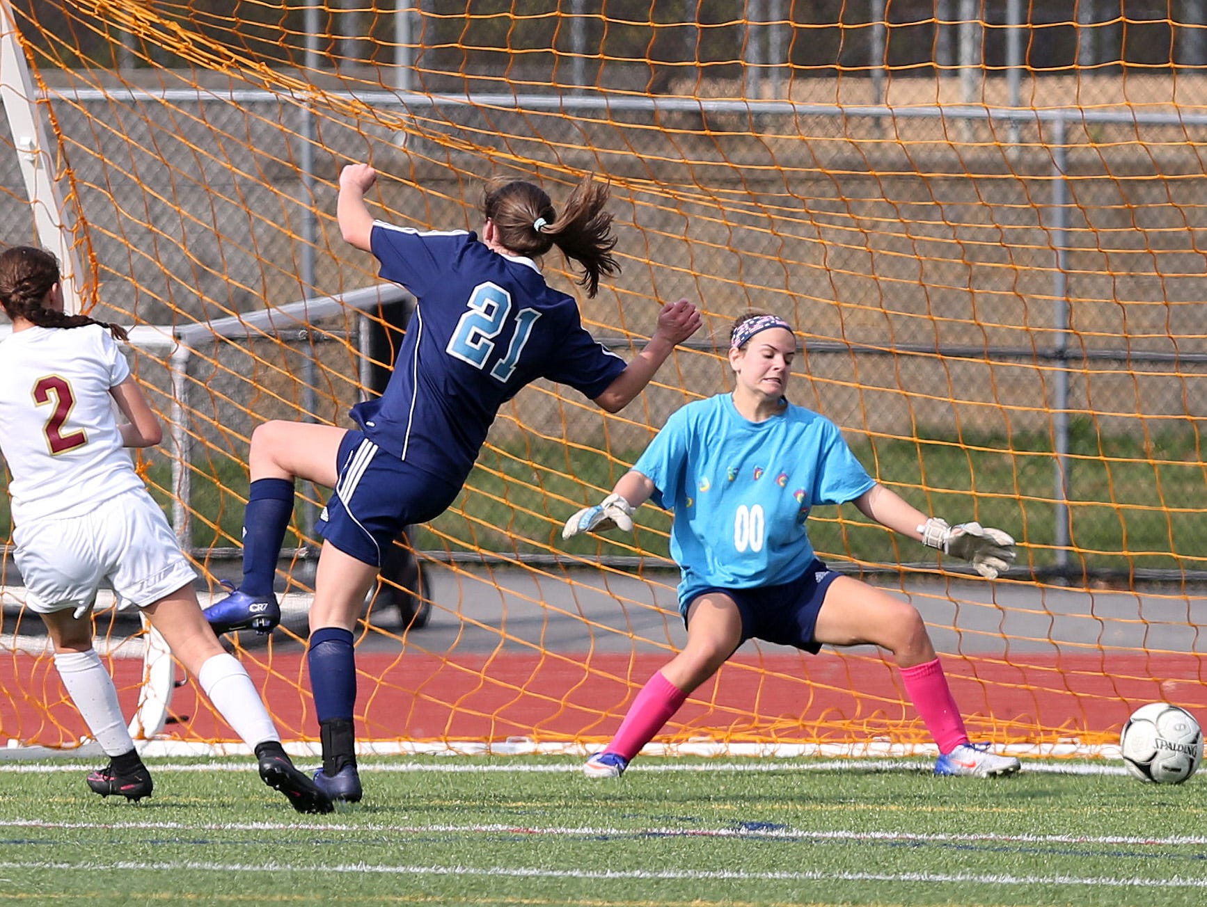 From left, Arlington's Meggie Buttinger (2) gets a shot by Suffern goal keeper Morgan Tamburro during the girls soccer Section 1 Class AA championship game at Yorktown High School Oct. 30, 2016. Arlington won the game 2-0.