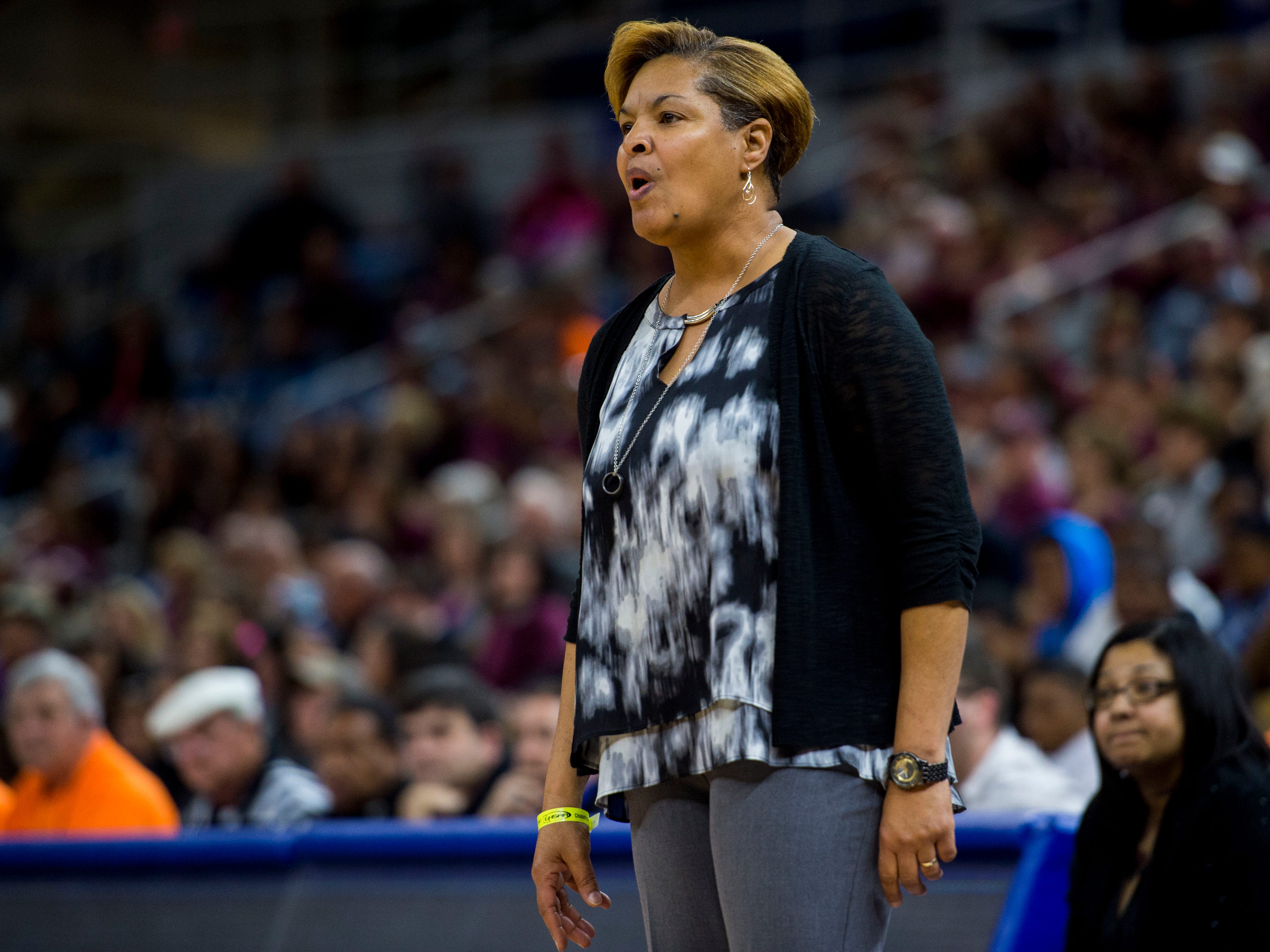 North Central head coach Vanessa Taylor calls a play adjustment during the first half of the LHSAA Class 1A Girls' Basketball State Championship game against Vermilion Catholic at Burton Coliseum in Lake Charles, La., Saturday, Sept. 7, 2015. (AP Photo/The Daily Advertiser, Paul Kieu)