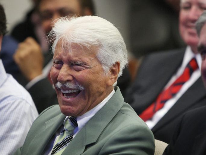 Actor Efrem Zimbalist Jr. laughs at a news conference where FBI director Robert Mueller (R) presented him with a badge as an honorary special agent, the highest civilian honor awarded by the FBI, on June 8, 2009 in Los Angeles, California. The actor was best known as Inspector Lewis Erskine in the TV show The FBI from 1965 to 1974, a roll that made Zimbalist an icon who inspired a generation of FBI agents. Zimbalist died on May 2, 2014 at the age of 95.