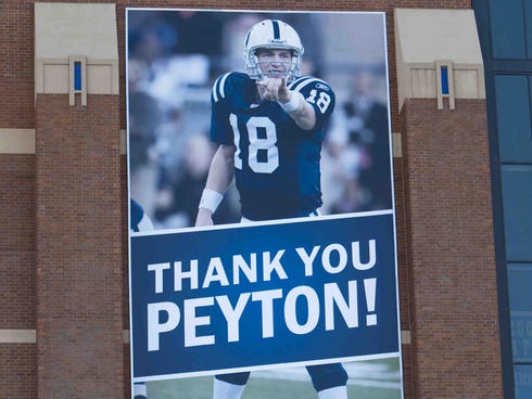 A modified Peyton Manning banner on the front of Lucas Oil Stadium, reading
